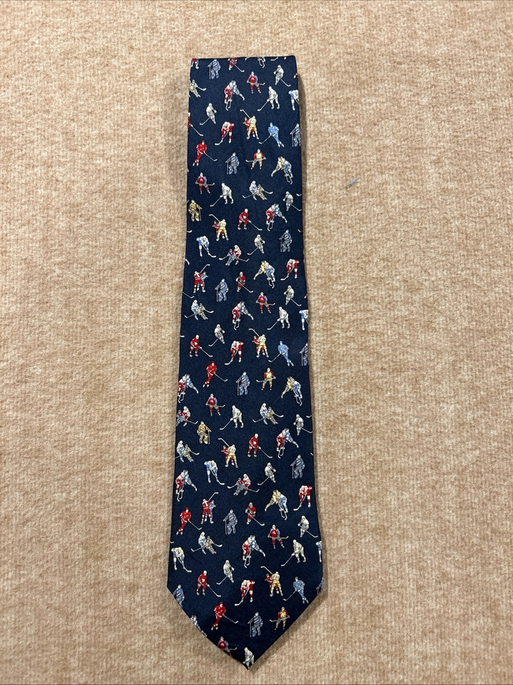 Museum Artifacts Silk Tie with Red, Cream, Blue and Gray Hockey Player Motif